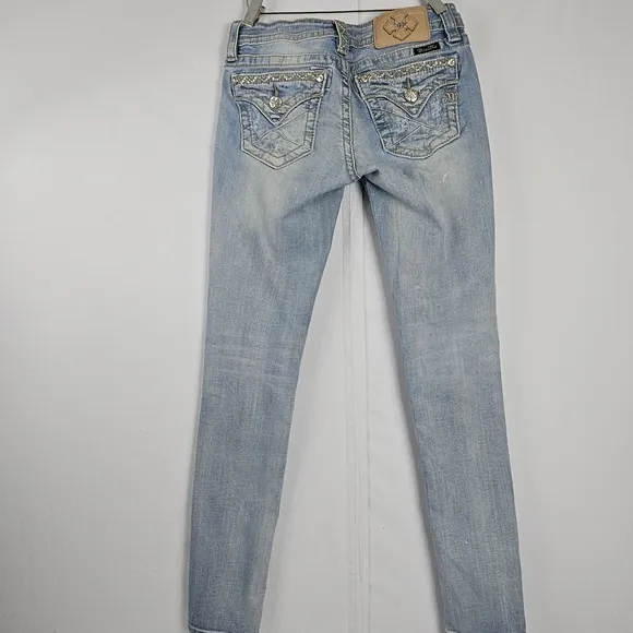 Miss Me factory distressed, rhinestone and embroidered skinny jeans size 27
