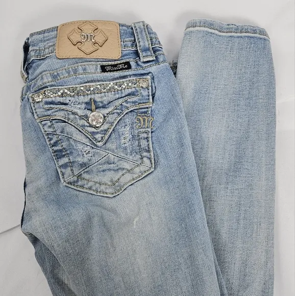 Miss Me factory distressed, rhinestone and embroidered skinny jeans size 27