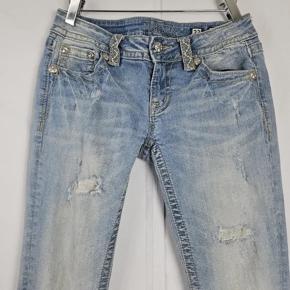 Miss Me factory distressed, rhinestone and embroidered skinny jeans size 27