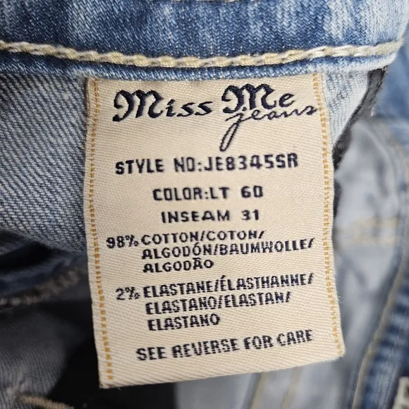 Miss Me factory distressed, rhinestone and embroidered skinny jeans size 27