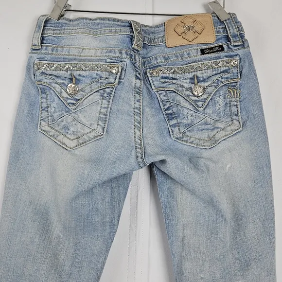 Miss Me factory distressed, rhinestone and embroidered skinny jeans size 27