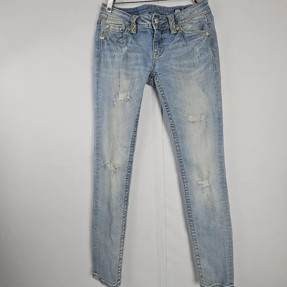 Miss Me factory distressed, rhinestone and embroidered skinny jeans size 27