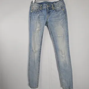 Miss Me factory distressed, rhinestone and embroidered skinny jeans size 27