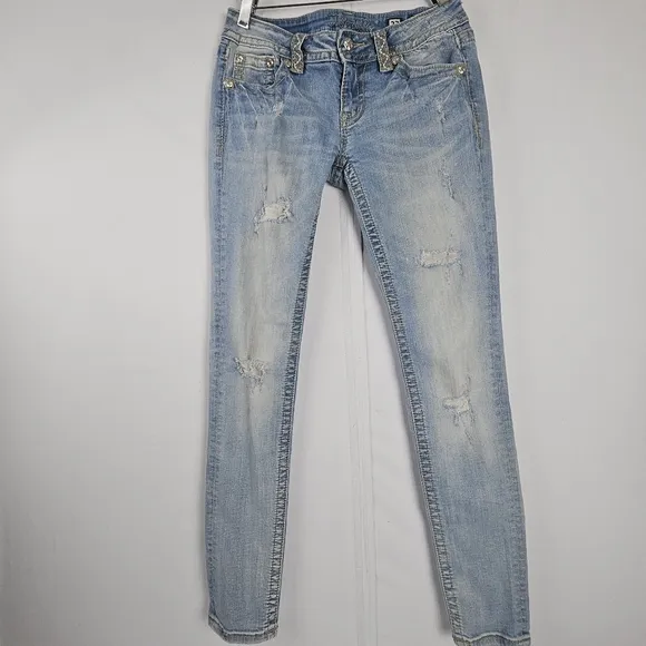 Miss Me factory distressed, rhinestone and embroidered skinny jeans size 27