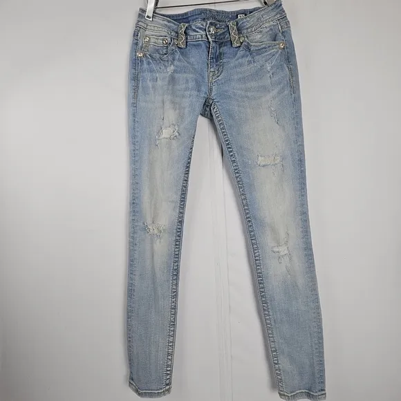Miss Me factory distressed, rhinestone and embroidered skinny jeans size 27