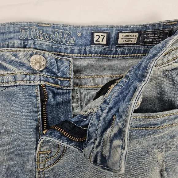 Miss Me factory distressed, rhinestone and embroidered skinny jeans size 27