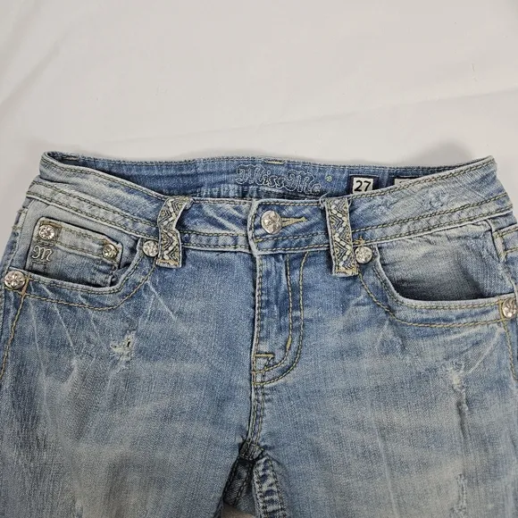Miss Me factory distressed, rhinestone and embroidered skinny jeans size 27