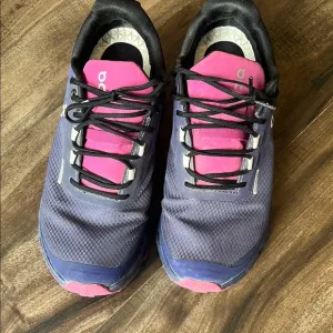 On Running Purple and Pink Athletic Shoes with Cushioned Midsole
