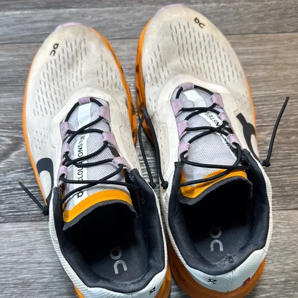 On Running Shoes with Orange Accents woman’s size 9.5 (b43)