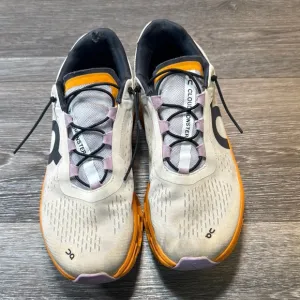 On Running Shoes with Orange Accents woman’s size 9.5 (b43)