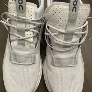 On Running White and Gray Sneakers with Modern Design